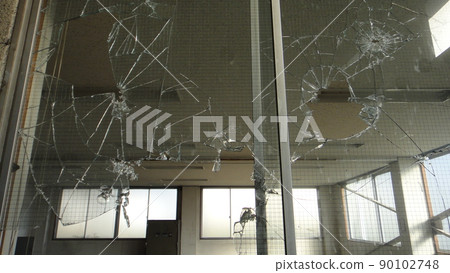 Window broken by stone throwing Window broken by stone throwing 90102748