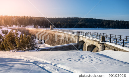 Sunny winter evenign at water dam 90103028