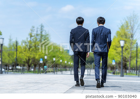 Behind businessmen Behind businessmen 90103040
