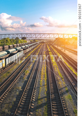Railway station of freight trains from a height at sunset Railway station of freight trains from a height at sunset 90103367