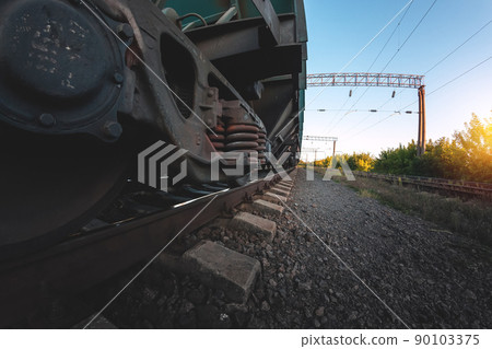 Wheels of a railway train on rails close up, cargo transportation 90103375