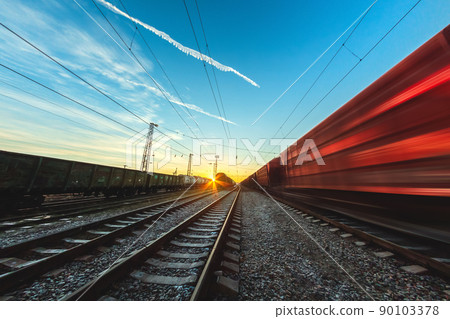 High-speed train moves by rail, delivery of goods by freight train. Train carriages at the station High-speed train moves by rail, delivery of goods by freight train. Train carriages at the station 90103378