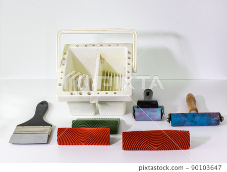 Collection of mixed media painting tools on white background in front view. 90103647