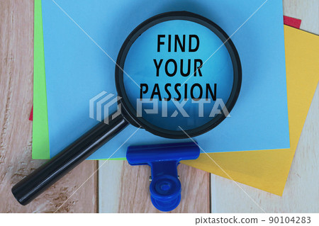 Find Your Passion on Blue Adhesive Note With Magnifying Glass On Wooden Desk. 90104283