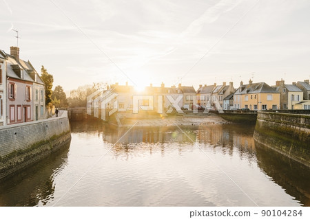 The Harbor of Isigny sur Mer during the sunrise at high tide The Harbor of Isigny sur Mer during the sunrise at high tide 90104284