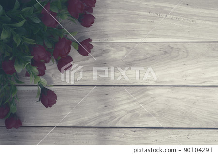 Wooden surface and red roses bouquet flat lay with copy space. Wooden surface and red roses bouquet flat lay with copy space. 90104291