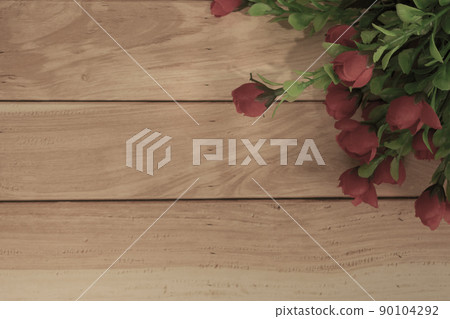 Wooden surface and red roses bouquet flat lay with copy space. Wooden surface and red roses bouquet flat lay with copy space. 90104292