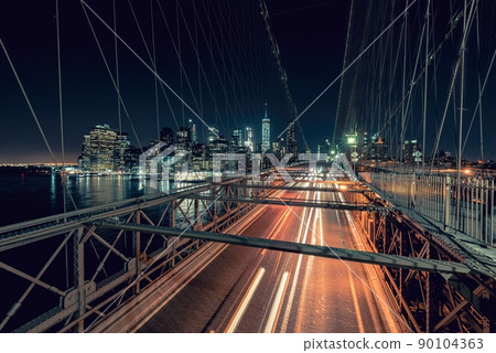 Speeding cars on Brooklyn Bridge, Downtown Manhattan, New York City, NY, USA Speeding cars on Brooklyn Bridge, Downtown Manhattan, New York City, NY, USA 90104363