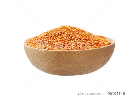 Raw red lentils in a wooden bowl isolated on white background. Raw red lentils in a wooden bowl isolated on white background. 90105146