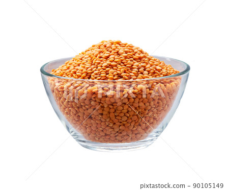 red lentils in a clear glass bowl isolated on white background. red lentils in a clear glass bowl isolated on white background. 90105149