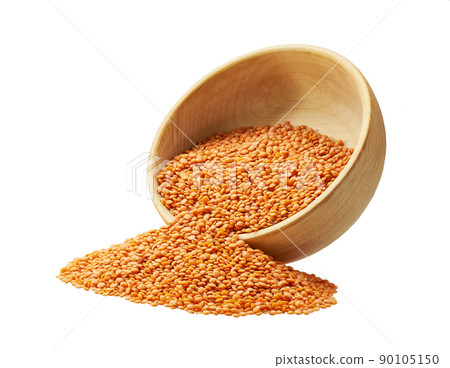 Grains red lentils are scattered out of the wooden bowl. Grains red lentils are scattered out of the wooden bowl. 90105150