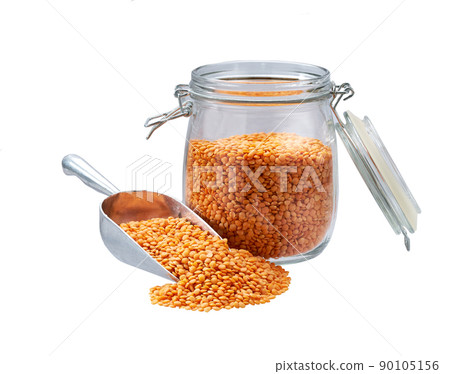 red lentils in metal scoop and  in glass storage jar isolated on white background. 90105156