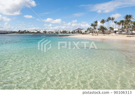 Sunny beach in, costa Teguise, Lanzarote, Canary Islands, Spain. Sunny beach in, costa Teguise, Lanzarote, Canary Islands, Spain. 90106313