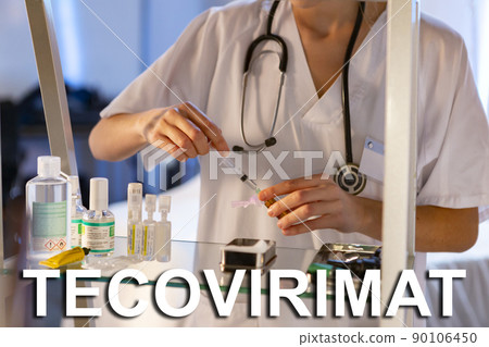 Tecovirimat. Nurse. Medical. Text written on an unfocused background and virus design of a nurse with an injection to give a vaccine. Virus disease concept. photography and design. Smallpox. Monkeypox 90106450