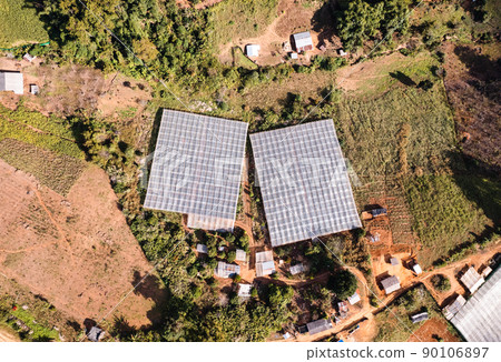 Aerial view of organic vegetable plots on agricultural field in farmland Aerial view of organic vegetable plots on agricultural field in farmland 90106897