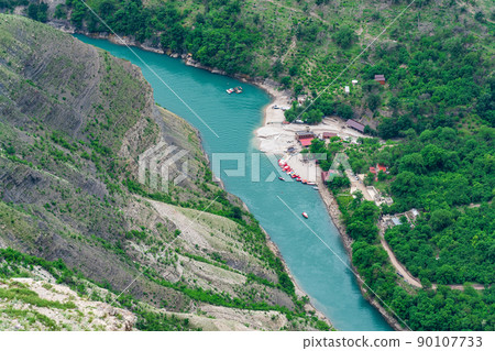 top view of the mountain river Sulak in Dagestan with a tourist boat base top view of the mountain river Sulak in Dagestan with a tourist boat base 90107733
