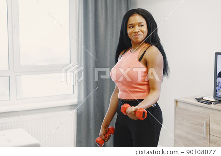 Woman in a isolations. Girl training in a room. Woman in a isolations. Girl training in a room. 90108077