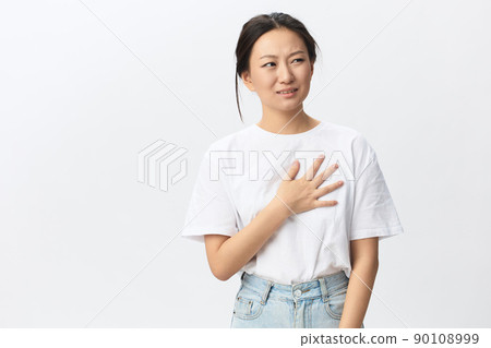 Heart attack. Suffering from pain tanned beautiful young Asian woman hold hand on chest heart crying posing isolated on white background. Injuries Poor health Illness concept. Cool offer Banner Heart attack. Suffering from pain tanned beautiful young Asian woman hold hand on chest heart crying posing isolated on white background. Injuries Poor health Illness concept. Cool offer Banner 90108999