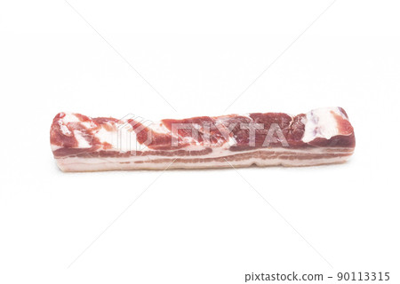 A selected piece of pork belly laid out on a white background 90113315