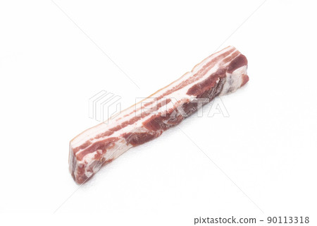 A selected piece of pork belly laid out on a white background 90113318