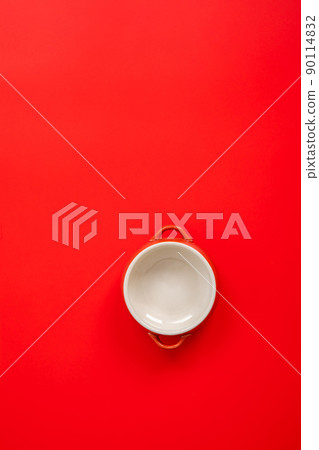 Plate placed on a red cloth background 90114832