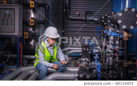 Industry engineer under checking the industry cooling tower air conditioner is water cooling tower air chiller HVAC of large industrial building to control air system Industry engineer under checking the industry cooling tower air conditioner is water cooling tower air chiller HVAC of large industrial building to control air system 90114855