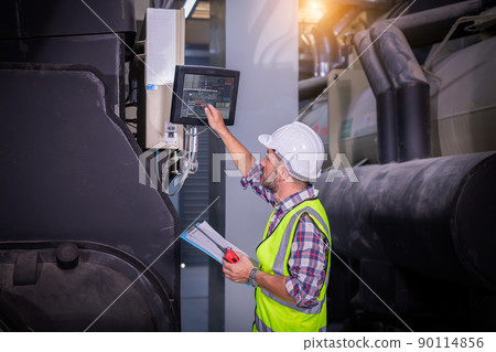 Industry engineer under checking the industry cooling tower air conditioner is water cooling tower air chiller HVAC of large industrial building to control air system Industry engineer under checking the industry cooling tower air conditioner is water cooling tower air chiller HVAC of large industrial building to control air system 90114856
