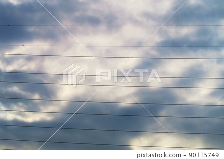 Scenery of cloudy sky across electric wires Scenery of cloudy sky across electric wires 90115749