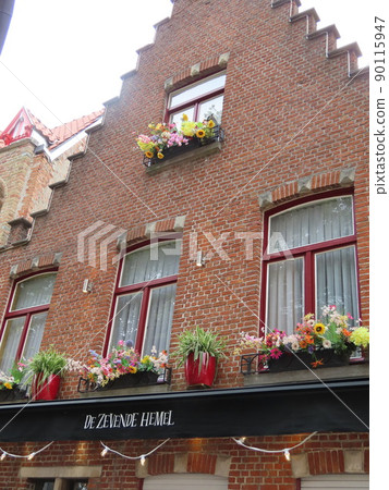Belgium Bruges jagged roof house windowsill flowers Belgium Bruges jagged roof house windowsill flowers 90115947