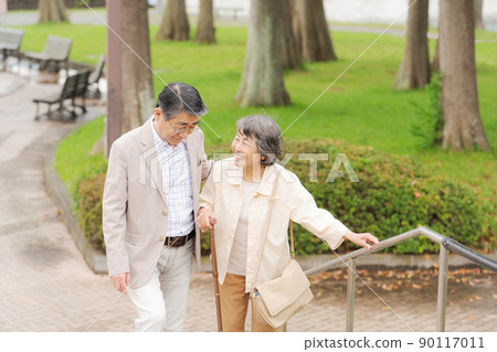 Up and down stairs senior couple 90117011