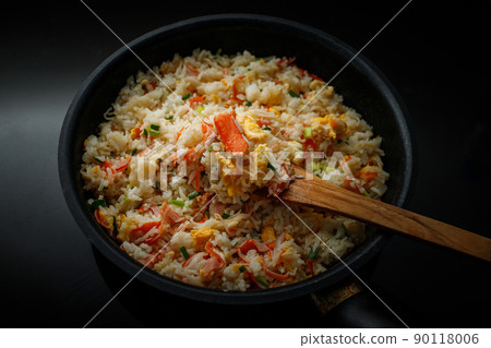 Fried rice with crab sticks in a pan for home cooking 90118006