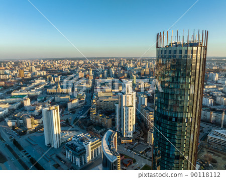 Yekaterinburg skyscraper aerial panoramic view at spring or autumn in clear sunset. Yekaterinburg is the fourth largest city in Russia located on the border of Europe and Asia. Yekaterinburg skyscraper aerial panoramic view at spring or autumn in clear sunset. Yekaterinburg is the fourth largest city in Russia located on the border of Europe and Asia. 90118112