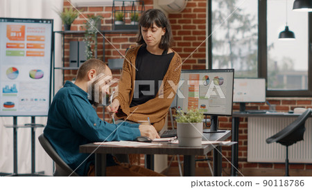 Man and woman brainstorming ideas to plan business project and design rate charts on computer for analysis. Colleagues working together to create marketing presentation and strategy 90118786