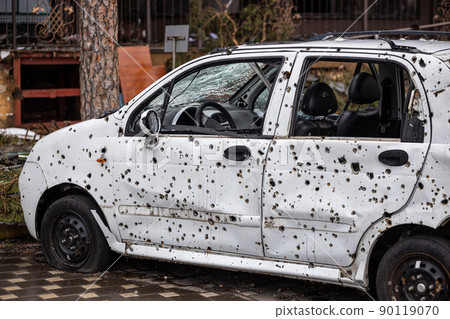 Irpin, Kyev region Ukraine - 09.04.2022: Cities of Ukraine after the Russian occupation. On the streets of Irpin. Shot cars. Irpin, Bucha, Hostomel. Irpin, Kyev region Ukraine - 09.04.2022: Cities of Ukraine after the Russian occupation. On the streets of Irpin. Shot cars. Irpin, Bucha, Hostomel. 90119070