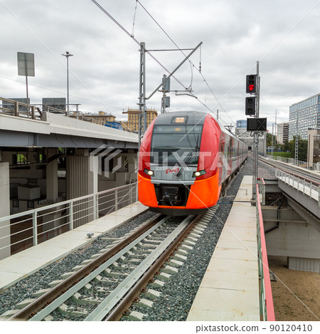 MOSCOW, RUSSIA - SEPTEMBER 13, 2016: Central Circle Line MCC Lastochka train at the station Delovoj centr MOSCOW, RUSSIA - SEPTEMBER 13, 2016: Central Circle Line MCC Lastochka train at the station Delovoj centr 90120410