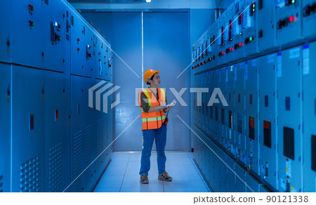 Engineer checking and inspecting at MDB panel .they working with electric switchboard to check range of voltage working in Main Distribution Boards factory. Engineer checking and inspecting at MDB panel .they working with electric switchboard to check range of voltage working in Main Distribution Boards factory. 90121338