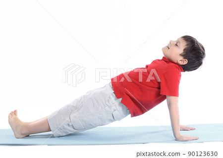 little boy performs morning health gymnastics.isolated on white little boy performs morning health gymnastics.isolated on white 90123630