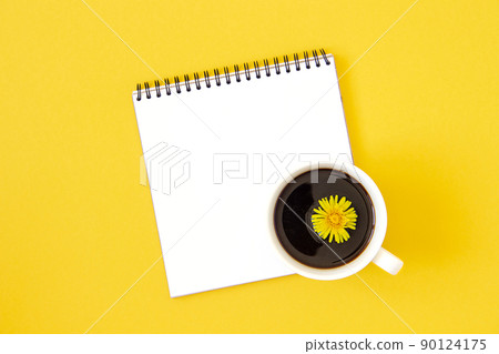 Summer minimal layout made with white blank notebook and cup of coffee on yellow background. Mock up in flat style. Top view Summer minimal layout made with white blank notebook and cup of coffee on yellow background. Mock up in flat style. Top view 90124175