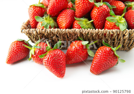 Fresh strawberries on table with basket 90125798