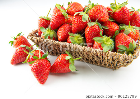 Fresh strawberries on table with basket 90125799