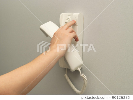 Hands opening door through intercom Hands opening door through intercom 90126285