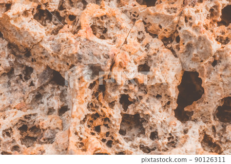 Abstract nature real photo background. Macro close up details dry rock crack stone solid foamy formations or lava volcanic, pumice texture ancient lunar style. Light orange vintage stock Abstract nature real photo background. Macro close up details dry rock crack stone solid foamy formations or lava volcanic, pumice texture ancient lunar style. Light orange vintage stock 90126311