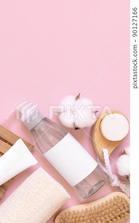 Homemade Cosmetics in tubes and bottles and natural accessories on pink, mockup 90127166