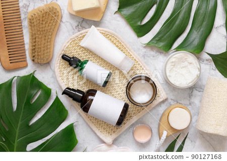 Natural cosmetics and skin and hair care accessories near monstera leaves, mockup Natural cosmetics and skin and hair care accessories near monstera leaves, mockup 90127168