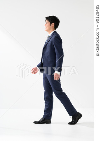 A smiling and sideways businessman man 90128485