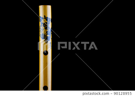 Chinese Bamboo Flute Closeup View on a Black Background 90128955