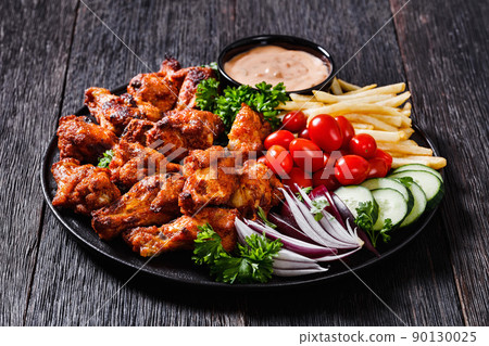 roast chicken wings with french fries and veggies 90130025