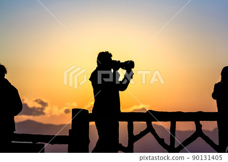Silhouette of a photographer at Eastern. Silhouette of a photographer at Eastern. 90131405