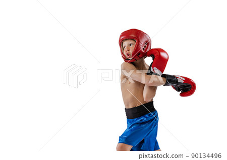 Portrait of little boy, kid in boxer gloves and shorts training isolated on white studio background. Concept of sport, movement, studying, achievements lifestyle. Portrait of little boy, kid in boxer gloves and shorts training isolated on white studio background. Concept of sport, movement, studying, achievements lifestyle. 90134496