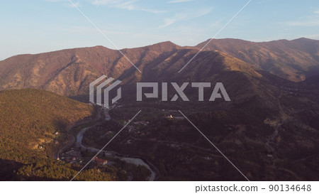 Aerial view of mountain peaks in the Italian Alps. 90134648